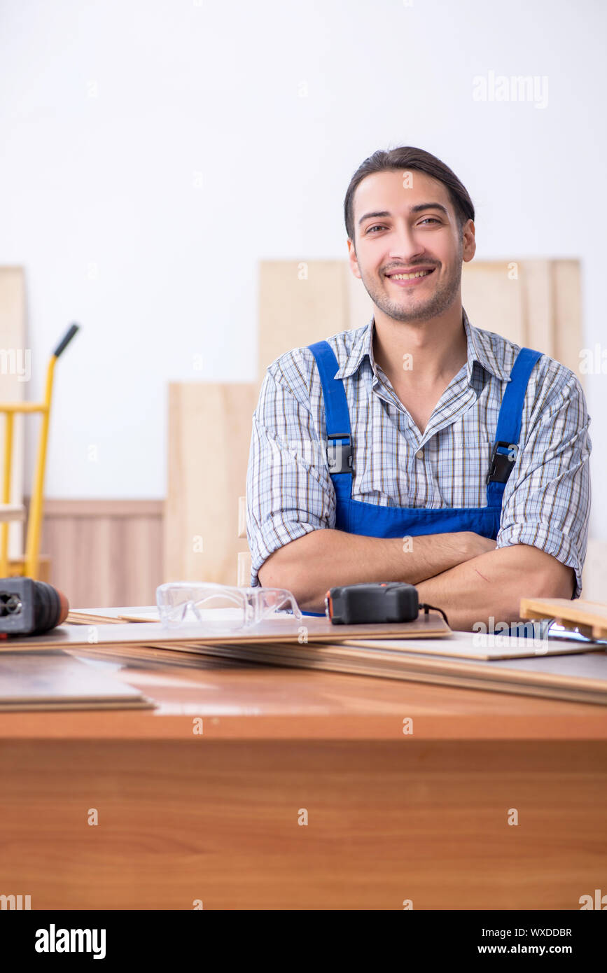 Young male carpenter working indoors Stock Photo