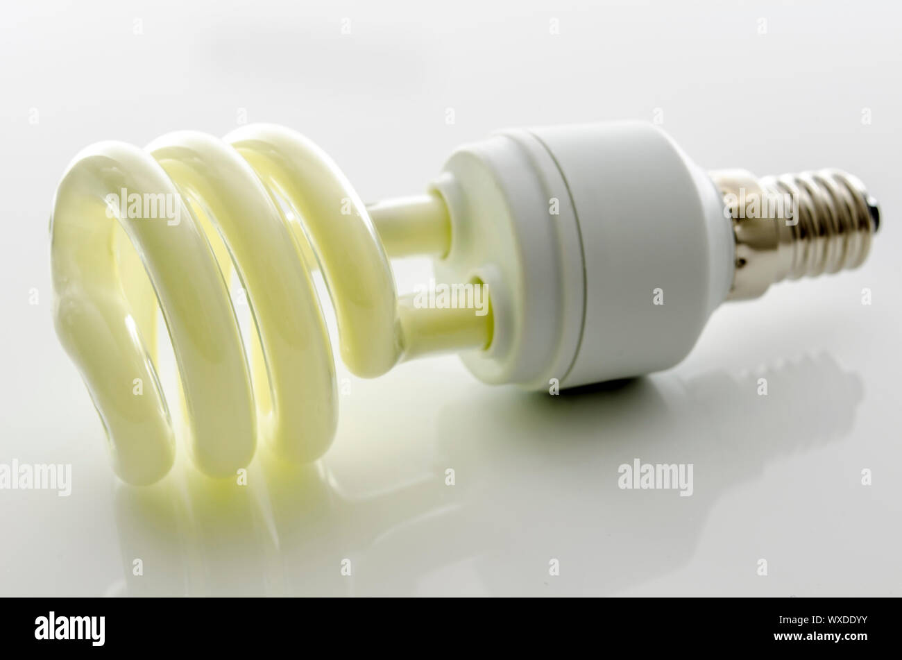 Energy saving fluorescent light bulb with reflection Stock Photo - Alamy