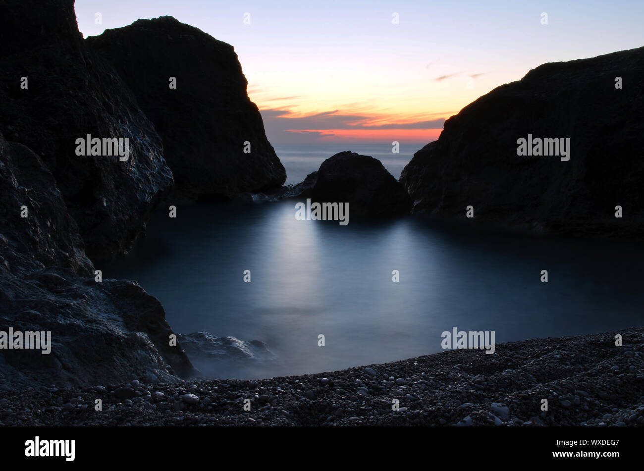 Rocks in the sea at sunset. Picture taken at the Greek island of ...