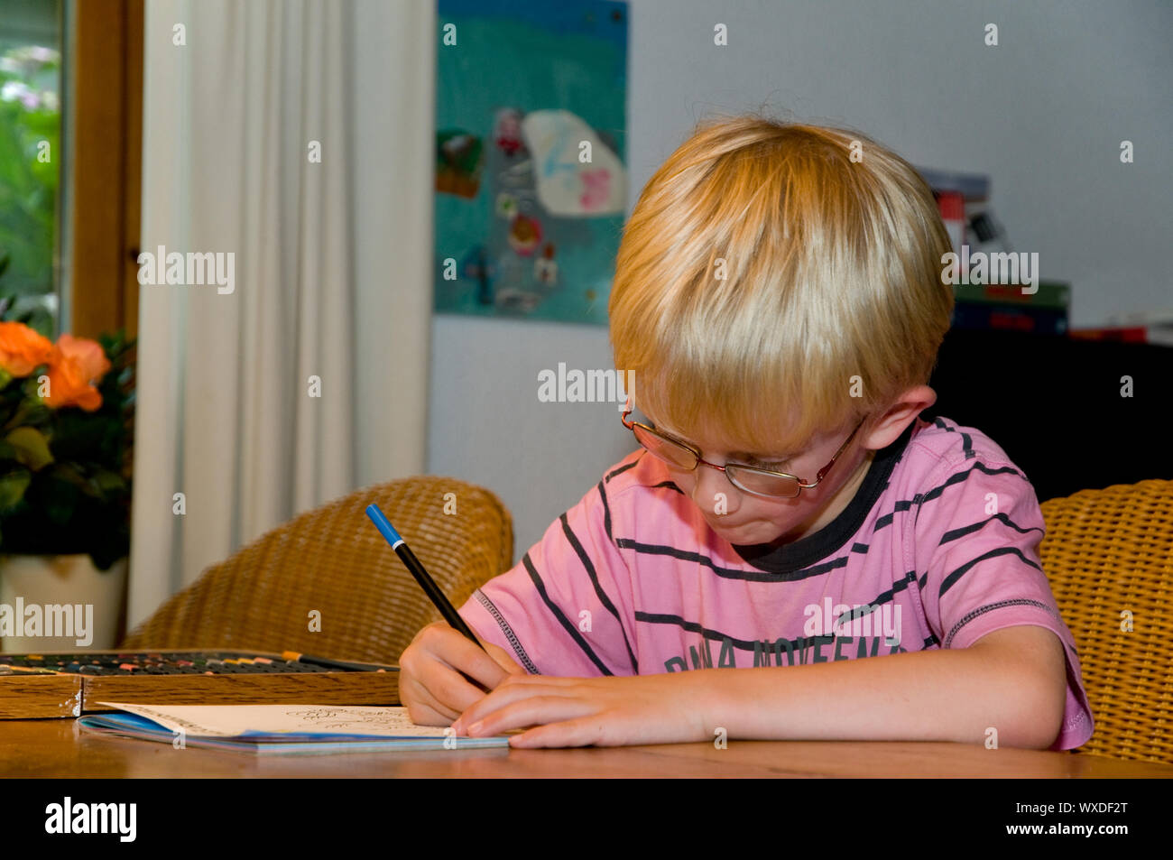 child is coloring and drawing Stock Photo - Alamy