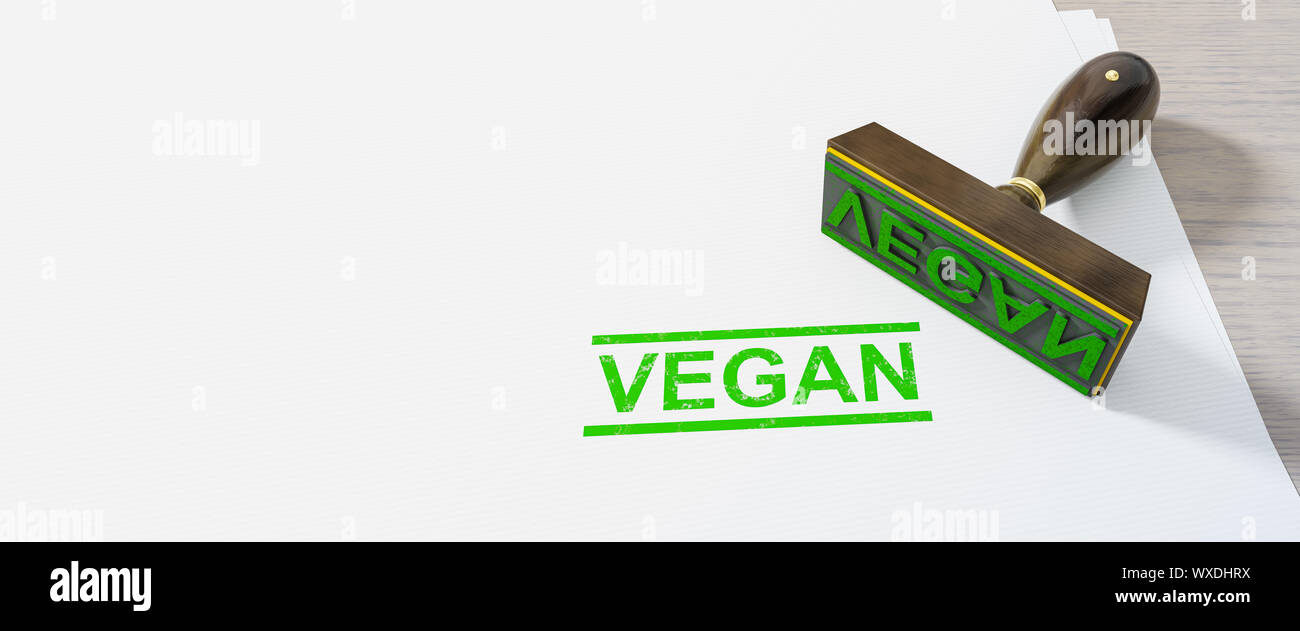 green stamp vegan on white paper background Stock Photo