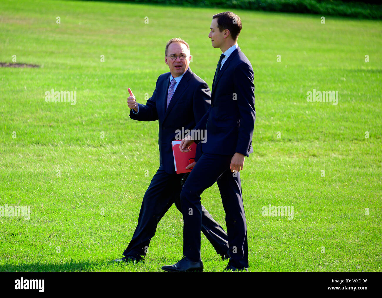 Acting White House Chief of Staff and Director of the Office of Management and Budget (OMB) Mick Mulvaney, left, converses with Senior Advisor Jared Kushner, right, as they walk across the South Lawn of the White Hopuse in Washington, DC to join United States President Donald J. Trump aboard Marine One as he prepares to depart for a trip to the western US on Monday, September 16, 2019. He will return early Thursday morning.Credit: Ron Sachs/CNP /MediaPunch Stock Photo
