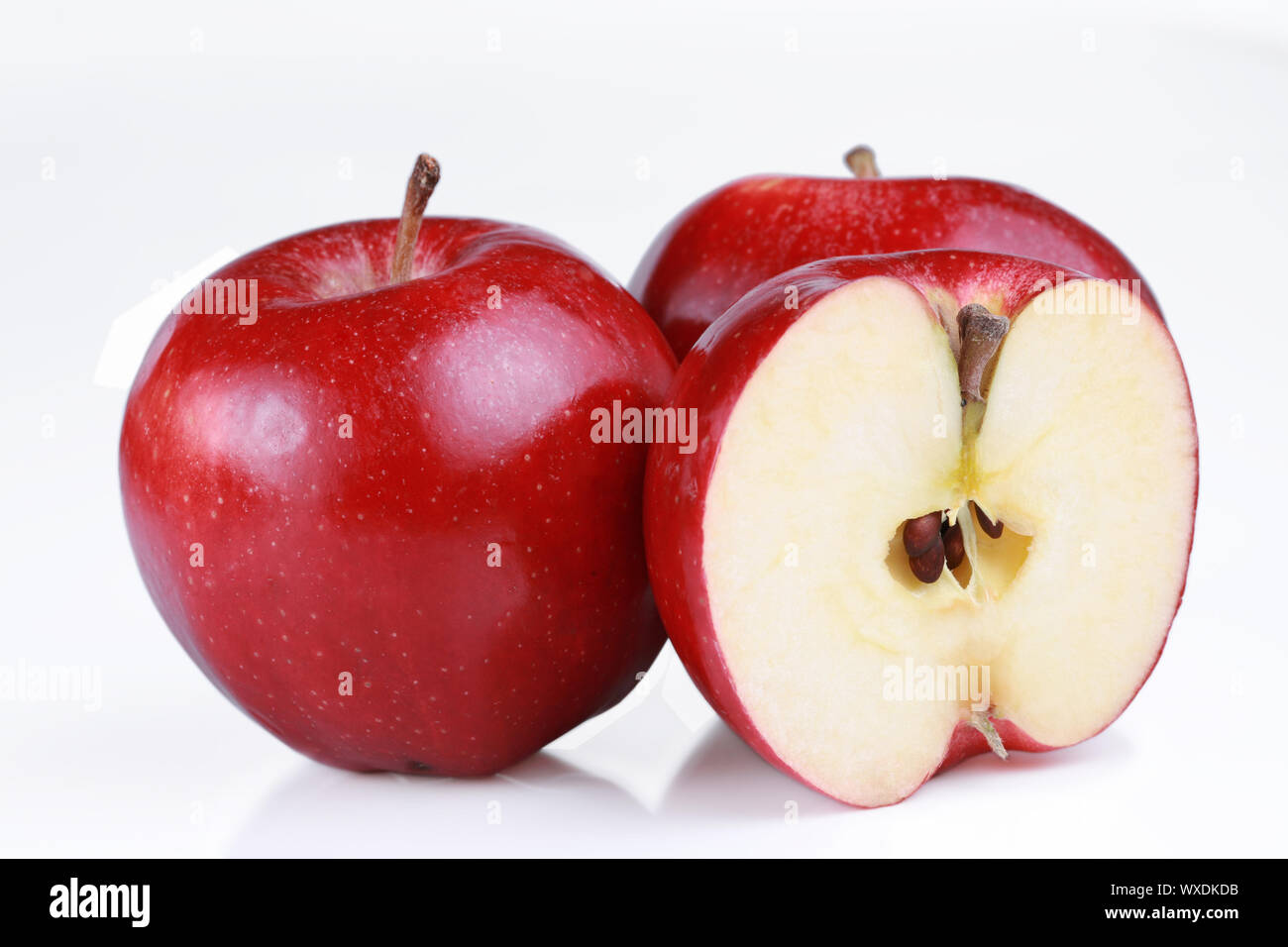 Red gala apples, one cut open to show seeds Stock Photo Alamy