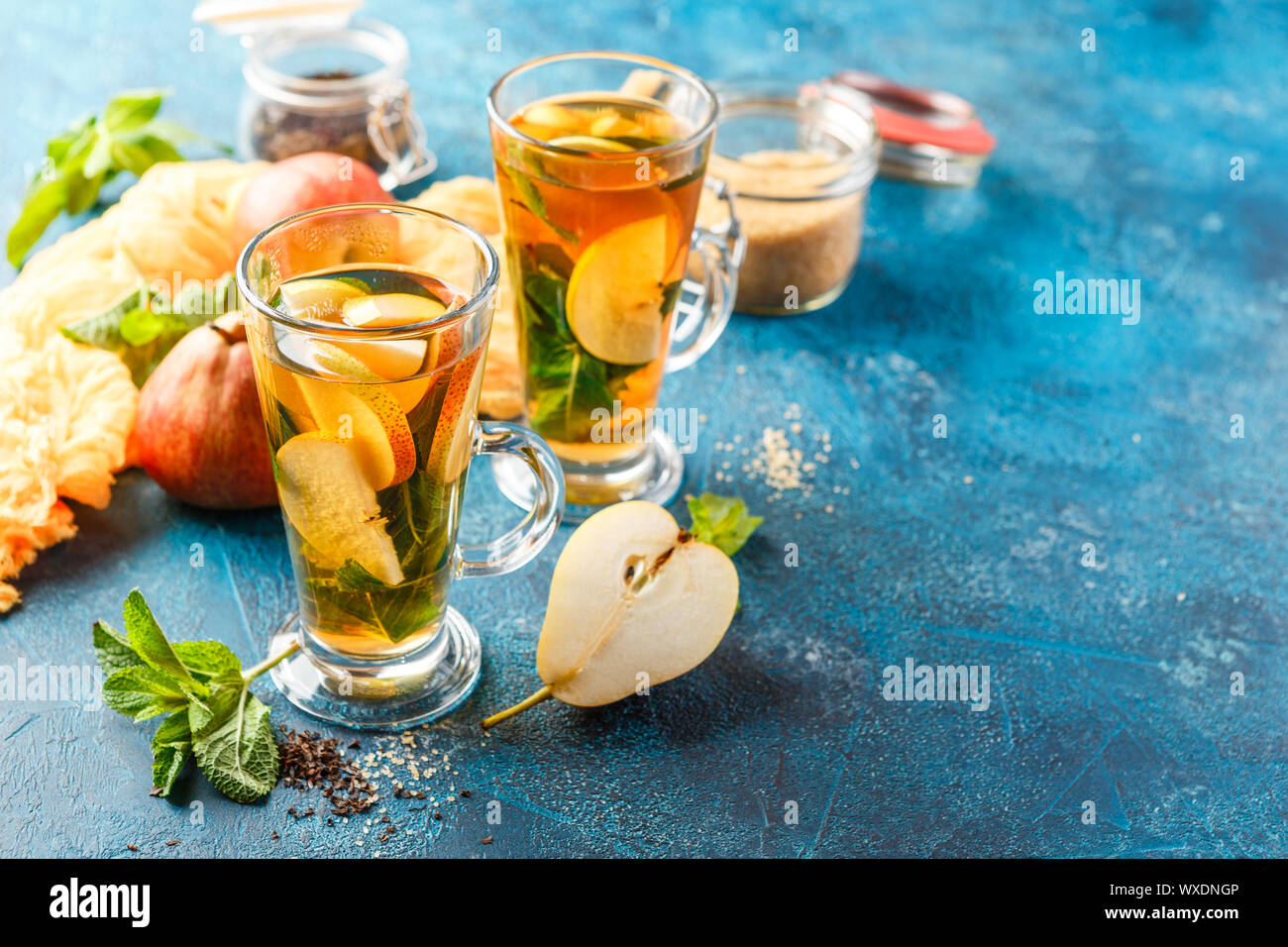 Hot fruit tea with ripe pears and mint Stock Photo