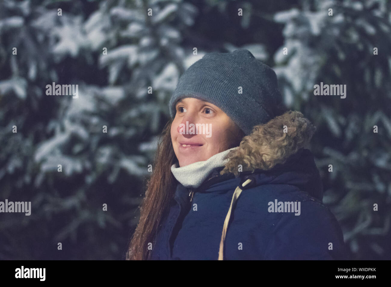 Night portrait of young woman in winter Stock Photo - Alamy