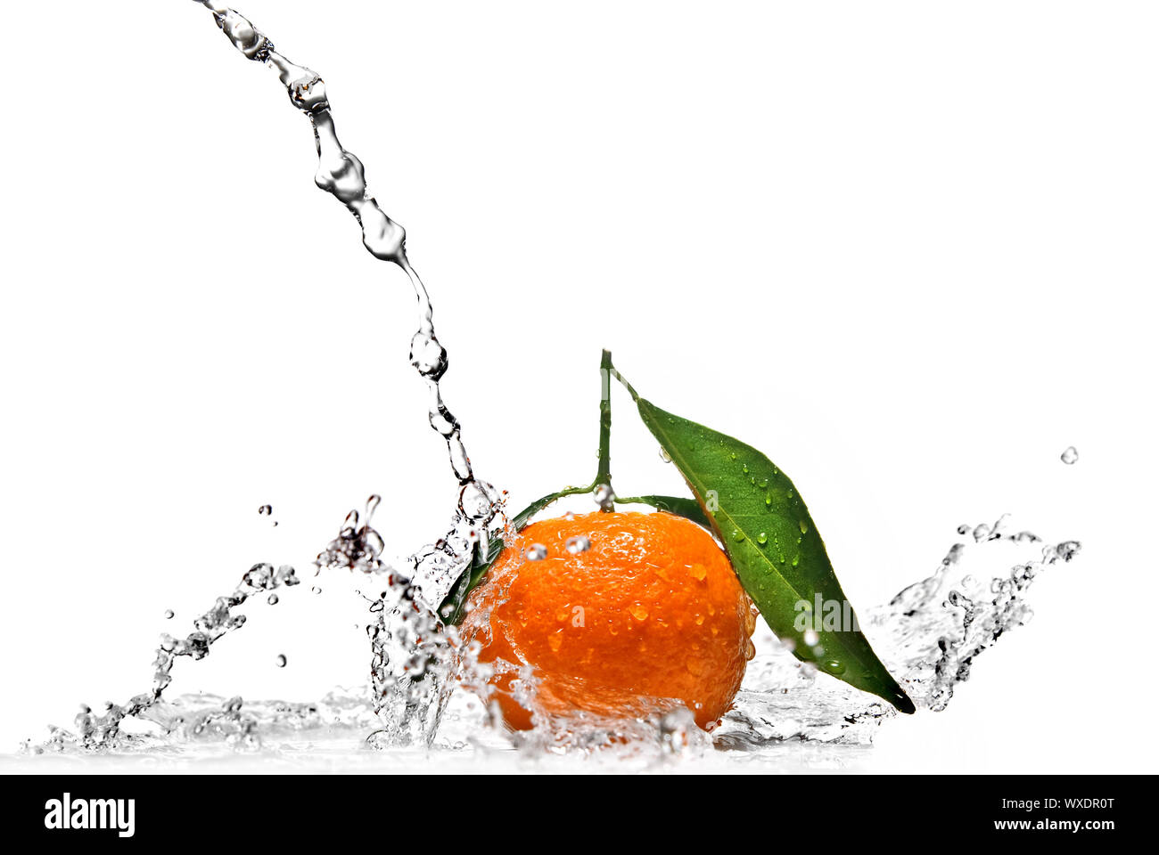 Tangerine with water splash isolated on white Stock Photo Alamy