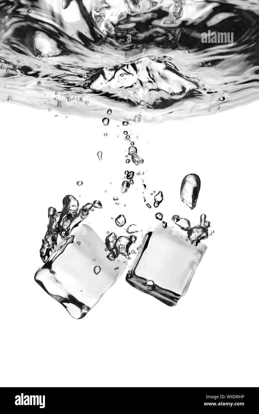 ice cubes dropped into water with splash isolated on white Stock Photo ...