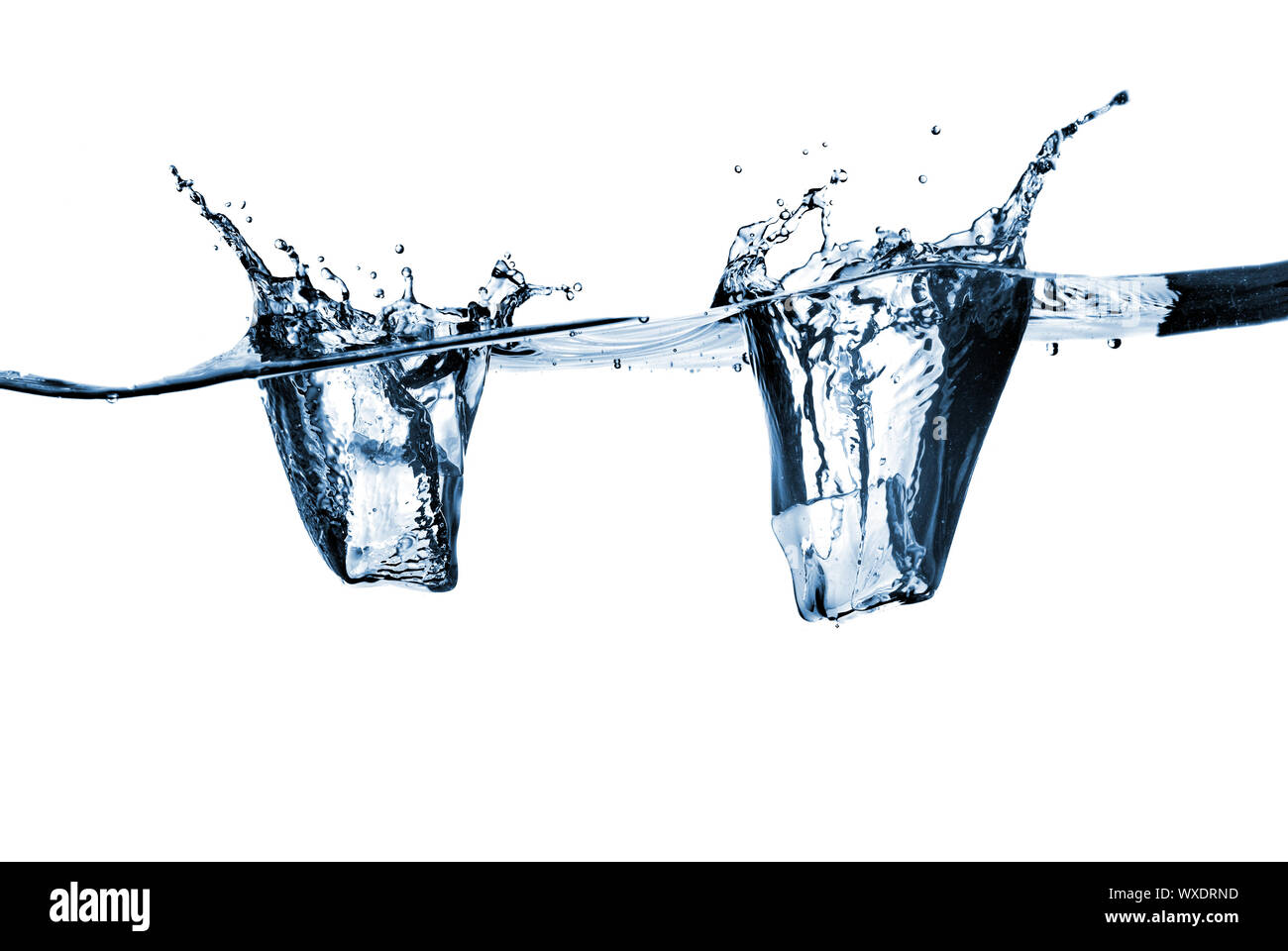 ice cubes dropped into water with splash isolated on white Stock Photo ...
