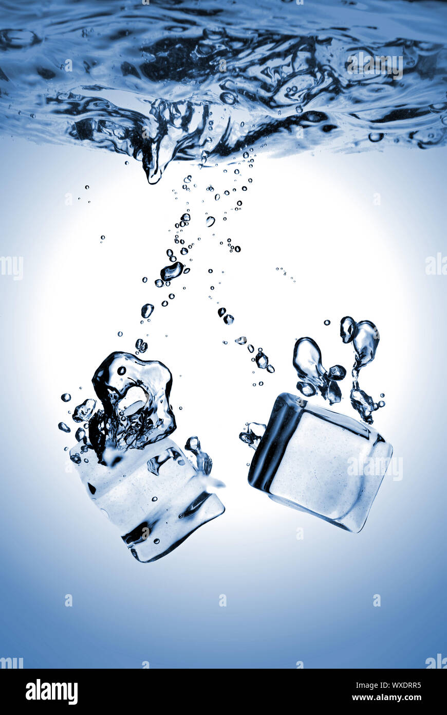 ice cubes dropped into water with splash isolated on white Stock Photo ...