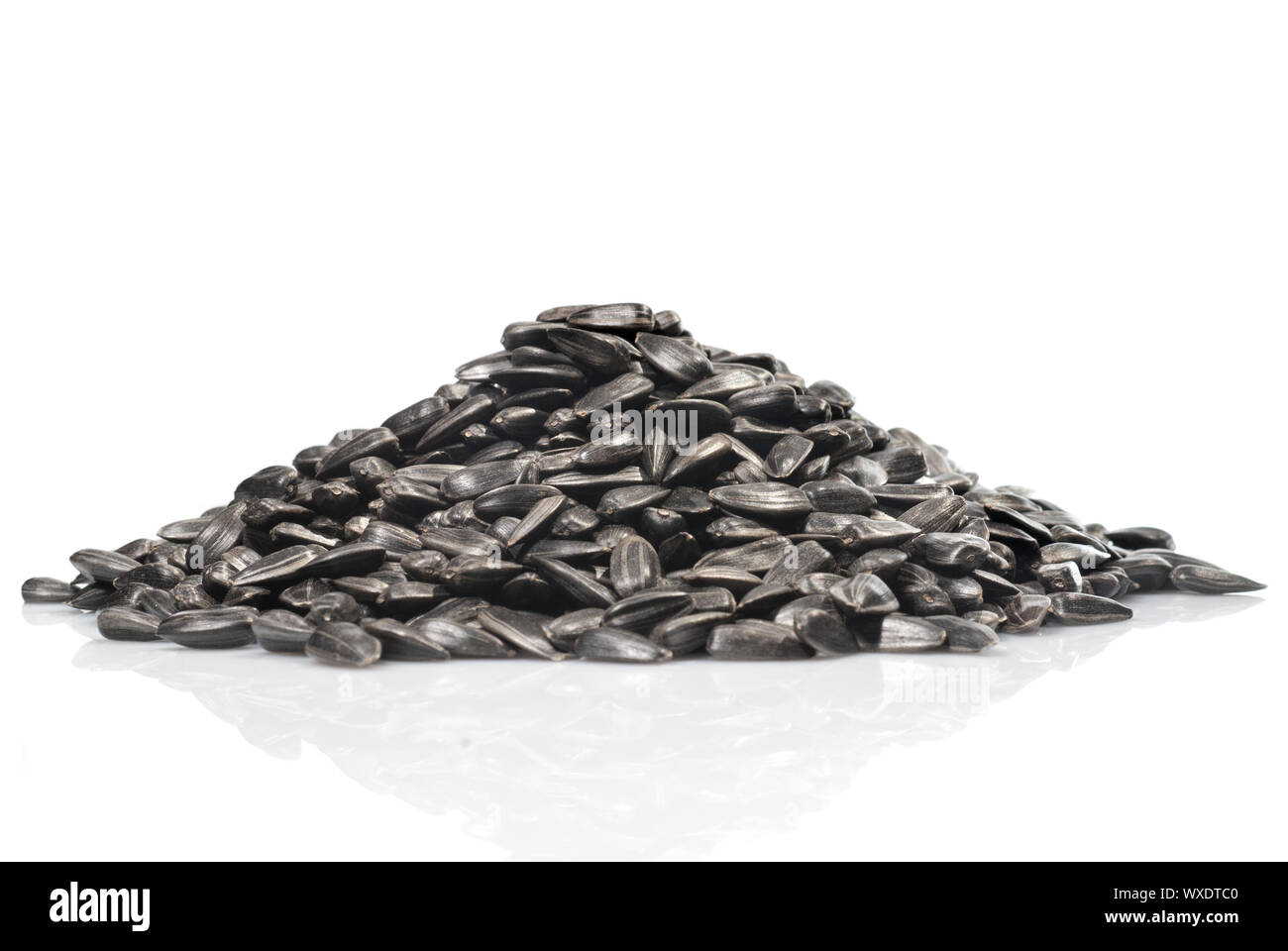 pile of black sunflower seeds isolated on a white background Stock ...
