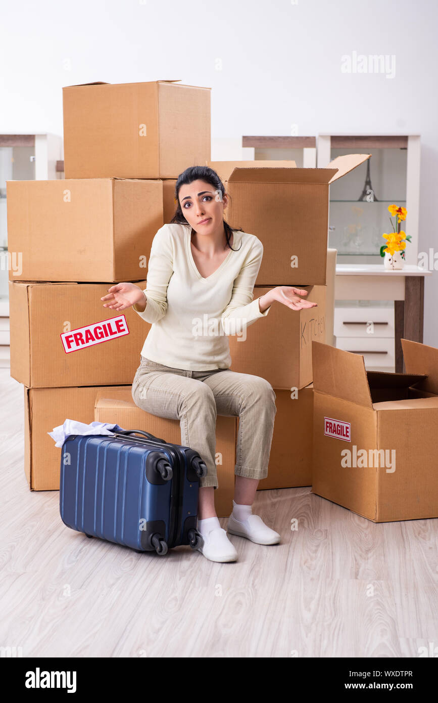 Young woman moving to new flat Stock Photo