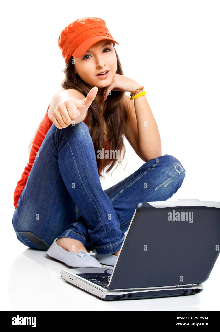 Beautiful young female student with thumbs up Stock Photo - Alamy