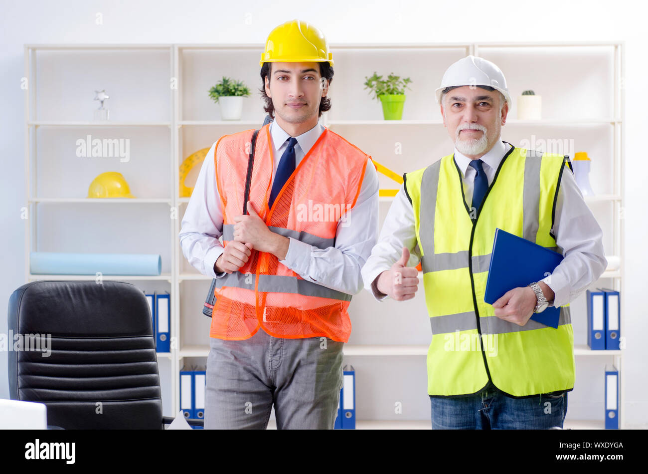 Two engineers colleagues working under project Stock Photo - Alamy