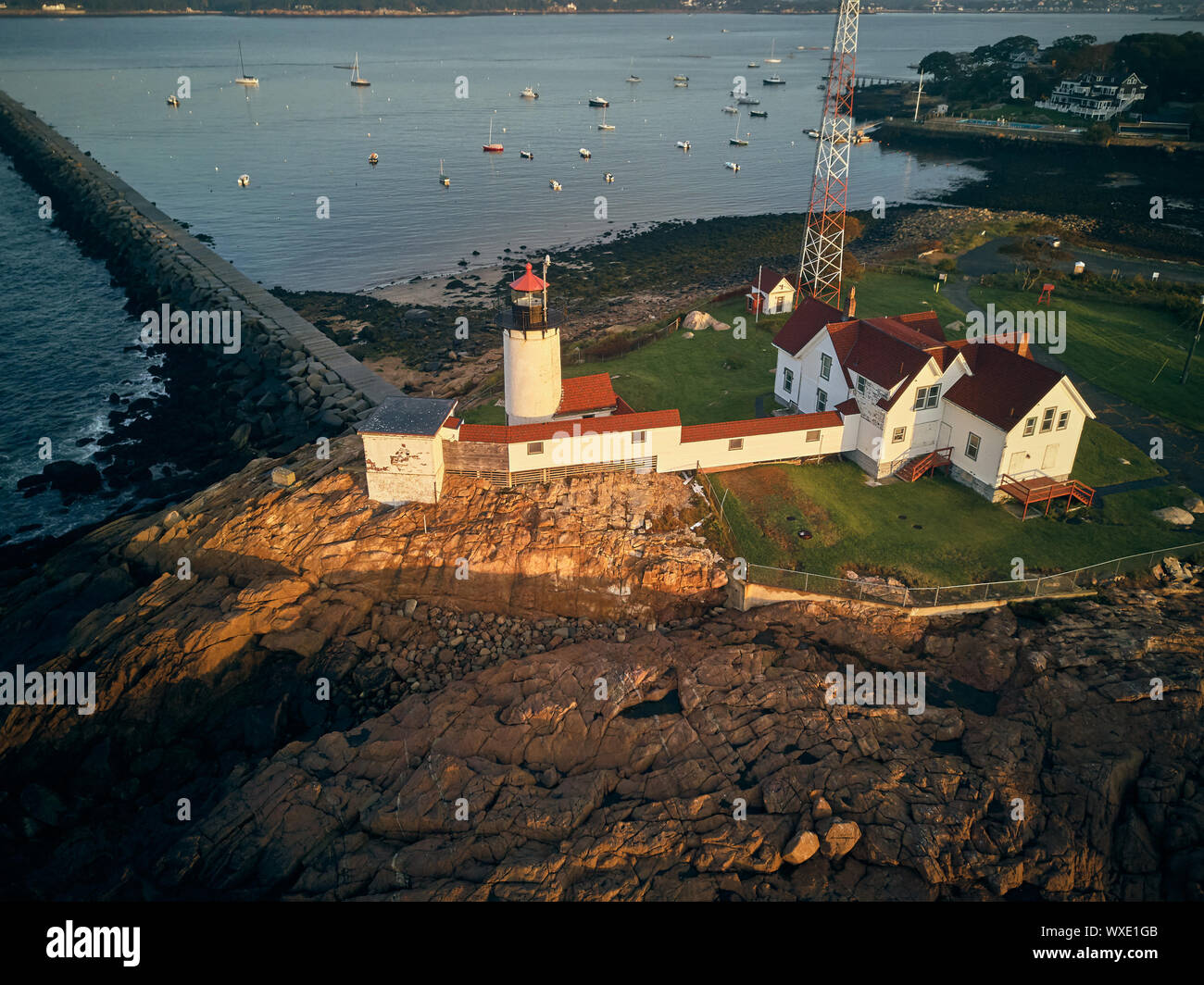 Lighthouse at sunrise in Gloucester, Massachusetts Stock Photo
