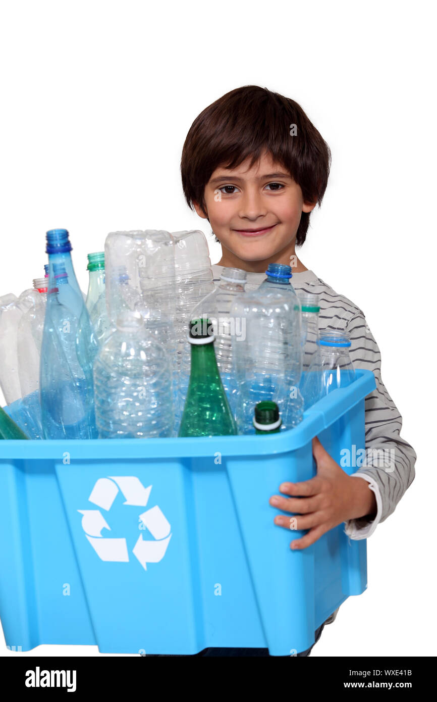 Little boy recycling plastic bottles Stock Photo