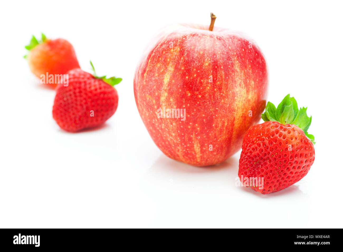 big juicy red ripe strawberries and apple isolated on white Stock Photo ...