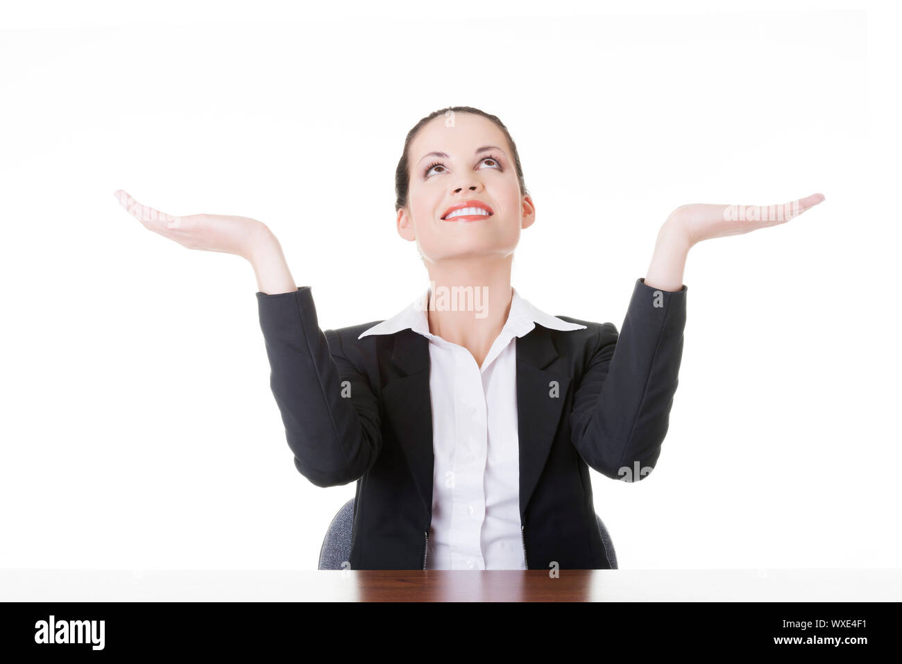Happy young business woman showing copy space on her palm, isolated on ...