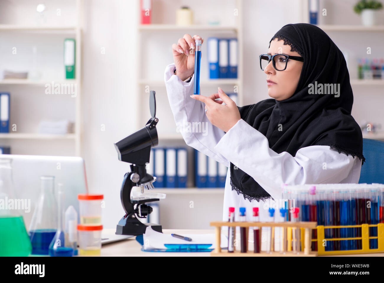 Female chemist in hijab working in the lab Stock Photo - Alamy