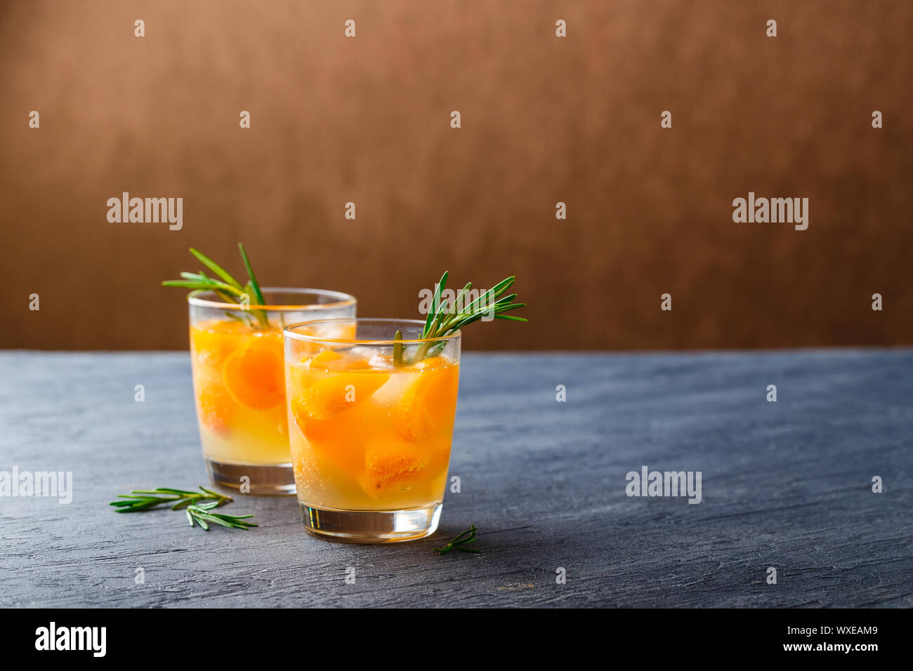 Summer drinks, rosemary aprcot cocktails Stock Photo Alamy