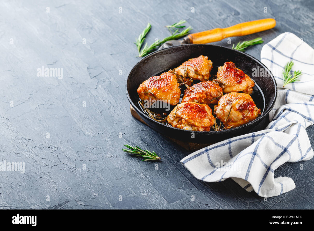 Delicious fried chicken thighs in a cast iron skillet Stock Photo Alamy