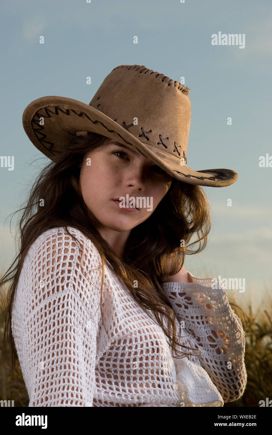 Beautiful slavonic girl in cowboy clothes pose in wheat field Stock ...