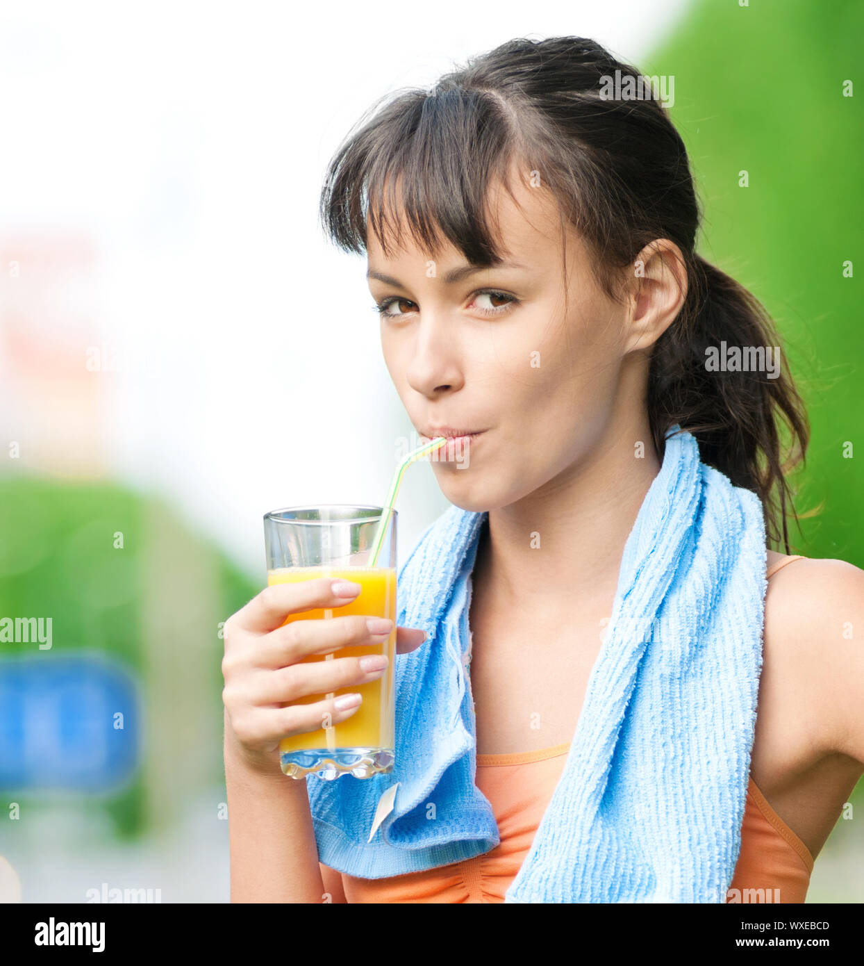 Teenage girl drinking orange juice after fitness exercise Stock Photo Alamy