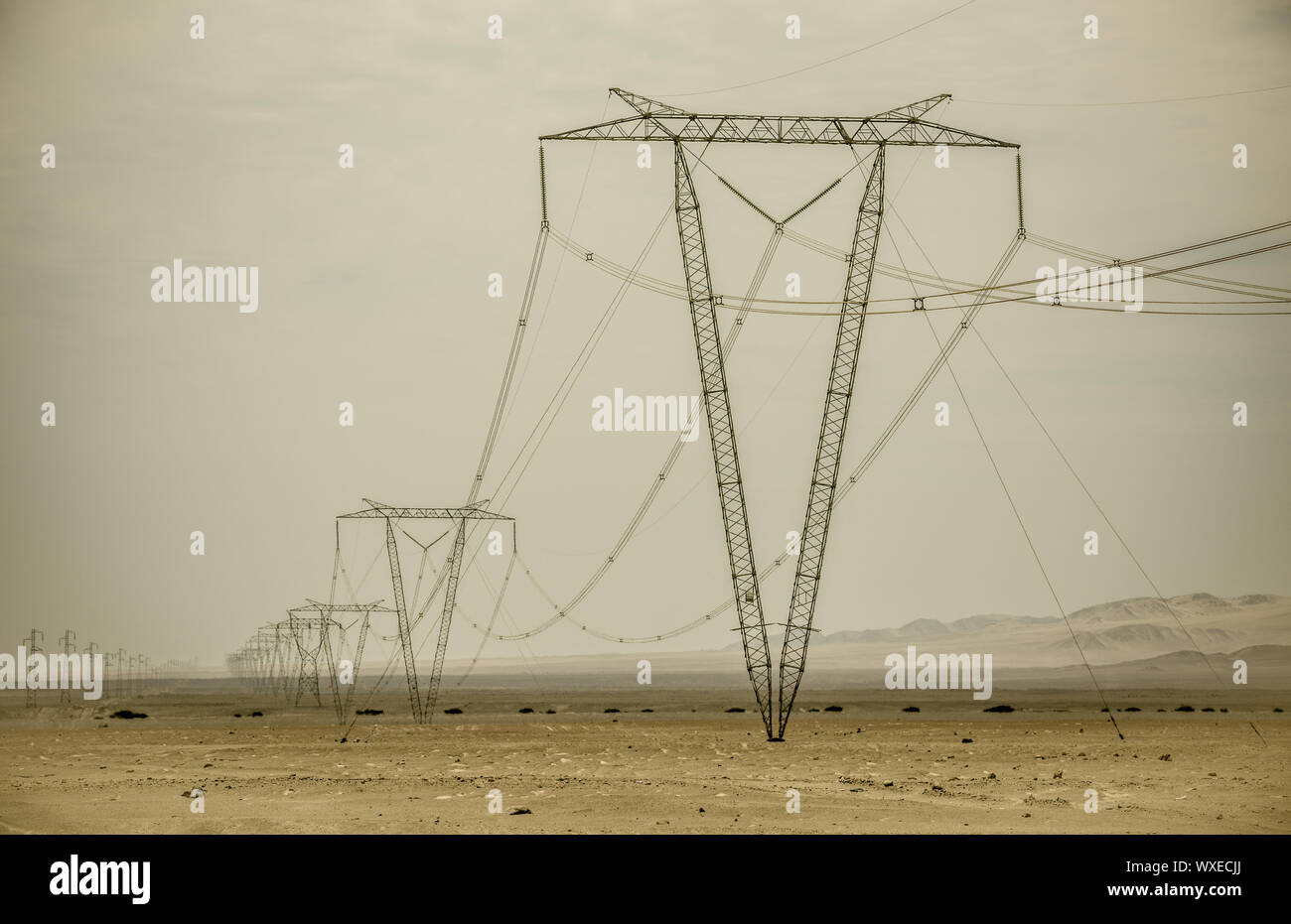 High voltage lines and power pylons Stock Photo