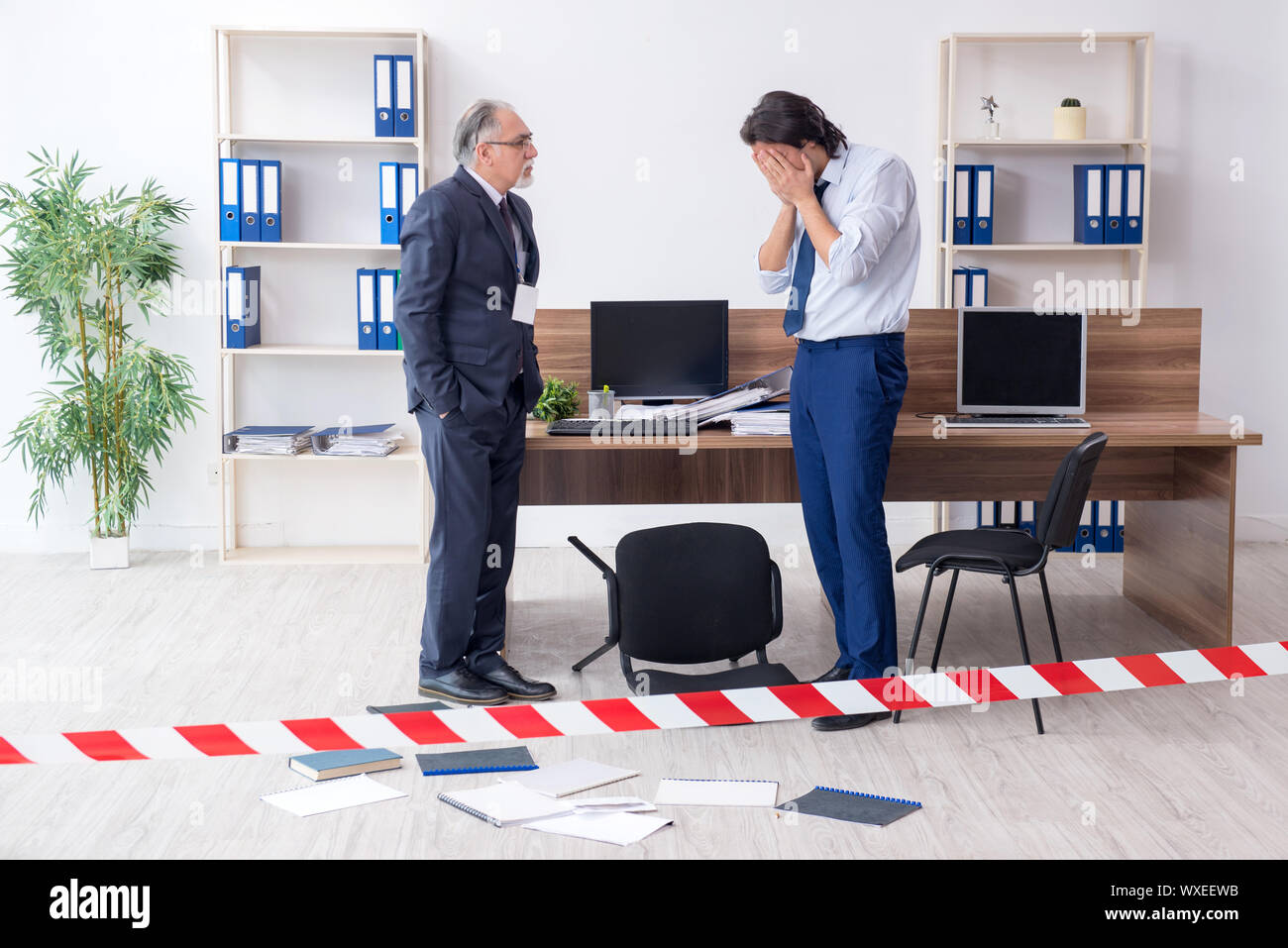 Forensic investigator investigating theft in the office Stock Photo