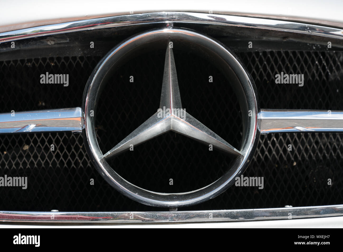 extra large Mercedes Benz radiator logo on an old timer sports car up