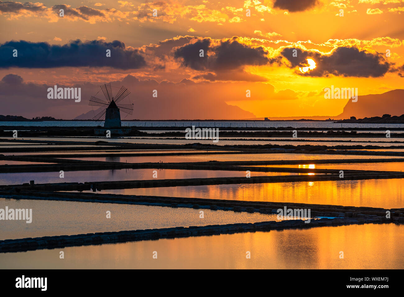 Marsala salt pans at sunset, Sicily, Italy Stock Photo