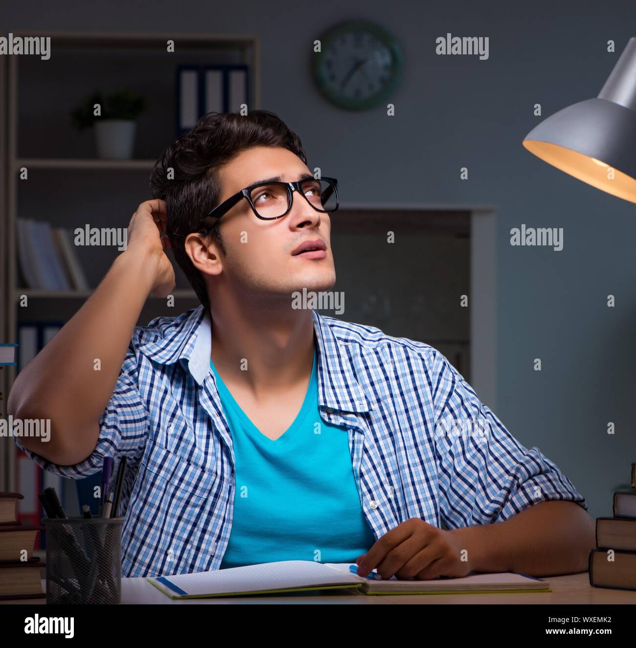 Student preparing for exams late night at home Stock Photo - Alamy