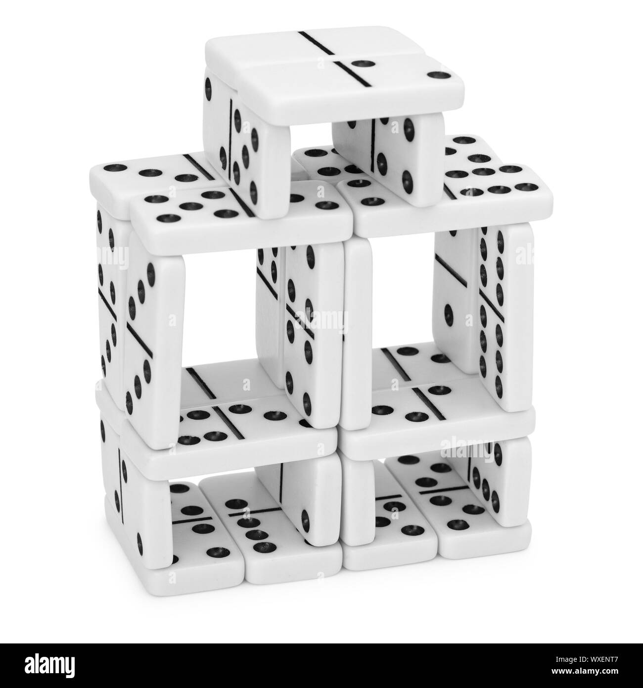 Intricate construction of dominoes on a white background Stock Photo