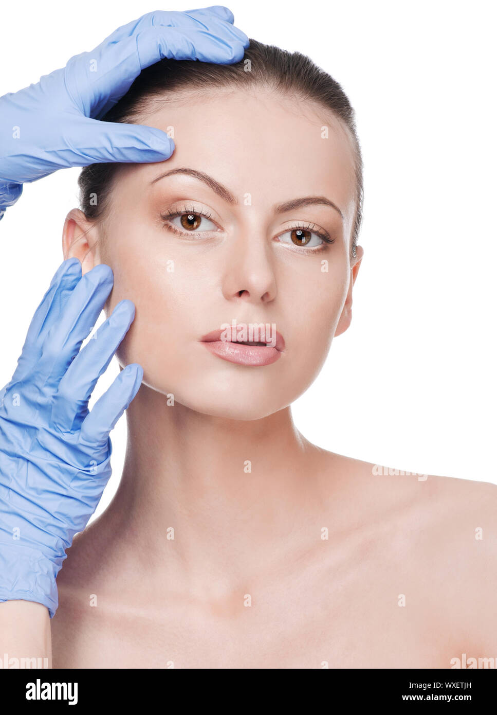 Beautician touch and exam health woman face. Plastic surgery. Isolated Stock Photo Alamy