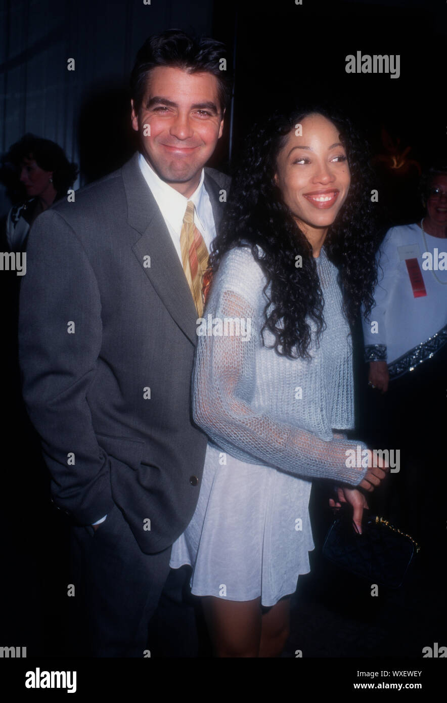 Beverly Hills, California, USA 11th December 1994 Actor George Clooney and actress Kimberly Russell attend the Hollywood Women's Press Club's 54th Annual Golden Apple Awards on December 11, 1994 at Beverly Hilton Hotel in Beverly Hills, California, USA.  Photo by Barry King/Alamy Stock Photo Stock Photo