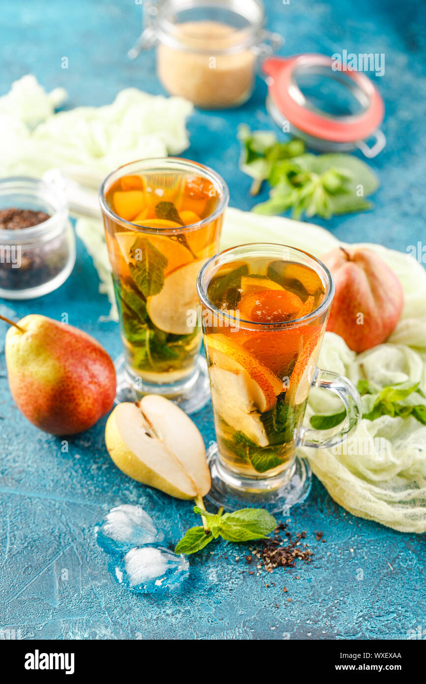 Ice tea with mint leaves and pear Stock Photo