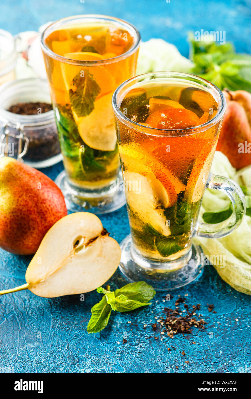 Ice tea with mint leaves and pear Stock Photo