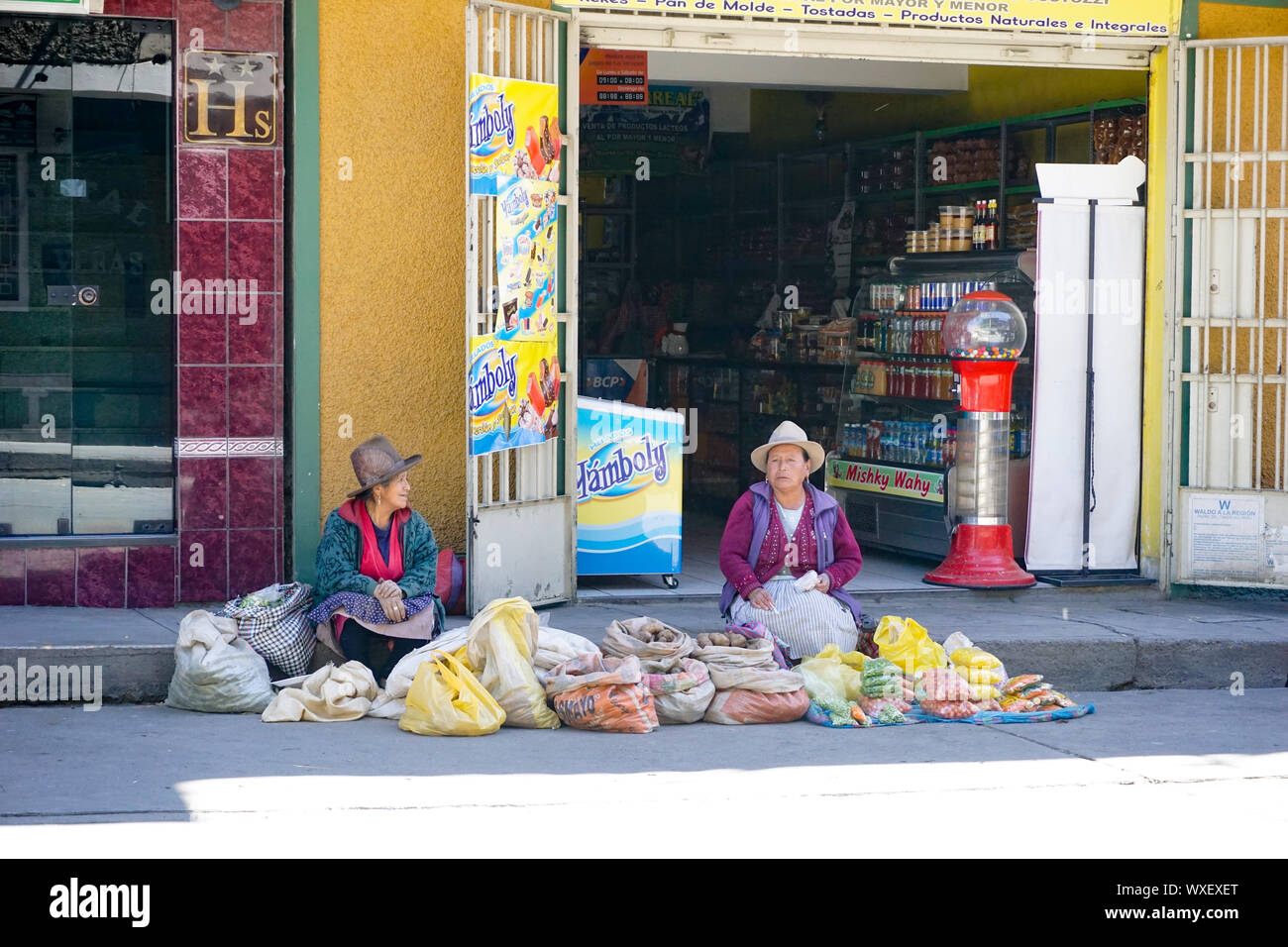 indigent Indio farmer women sell their fruit and vegetables on the streets of Huaraz Stock Photo