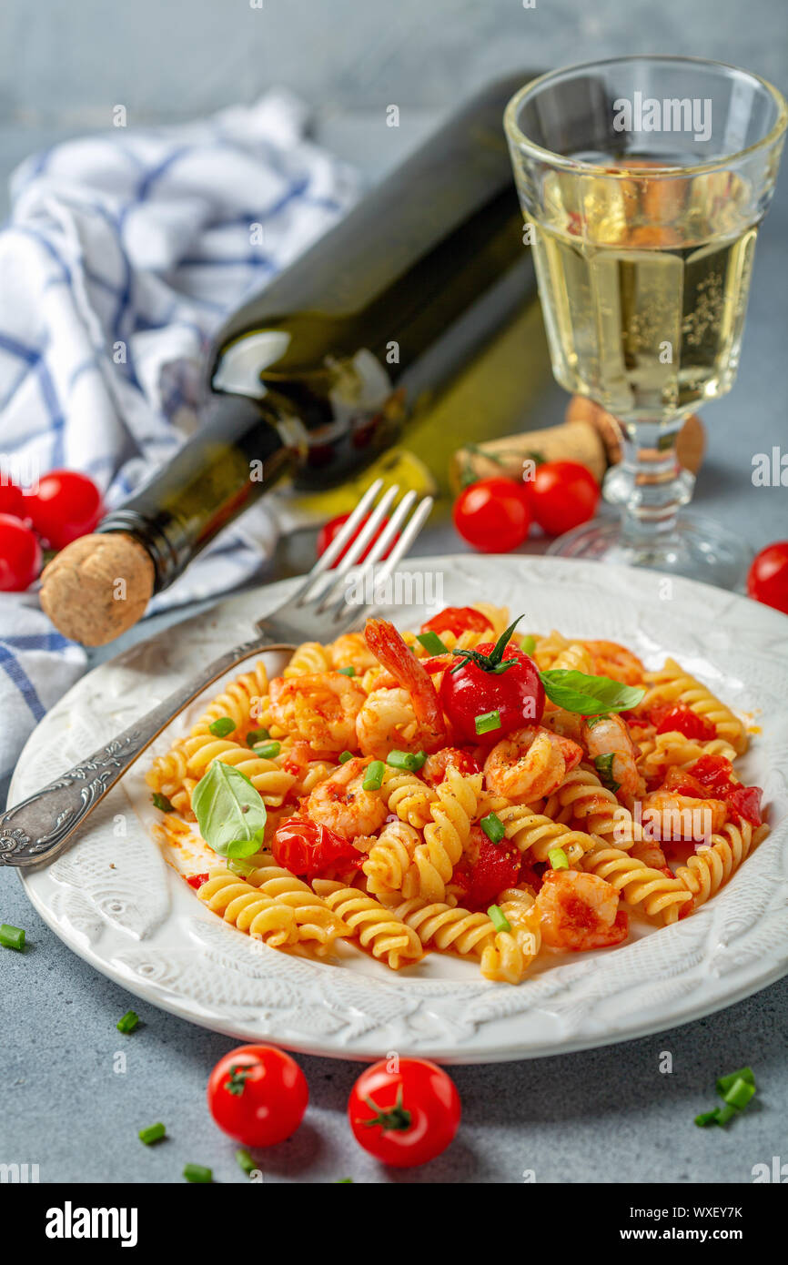 Fusilli pasta with shrimp in tomato sauce. Stock Photo