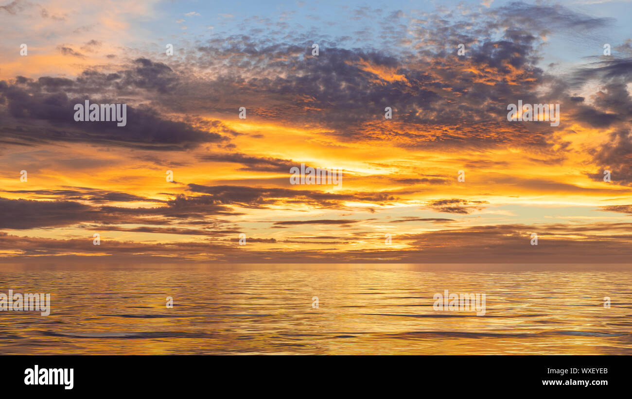 sunset sky at the ocean background Stock Photo - Alamy