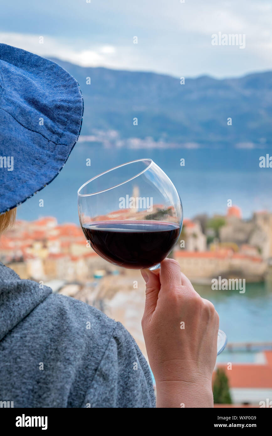 Caucasian woman drinking red wine in summer Stock Photo - Alamy