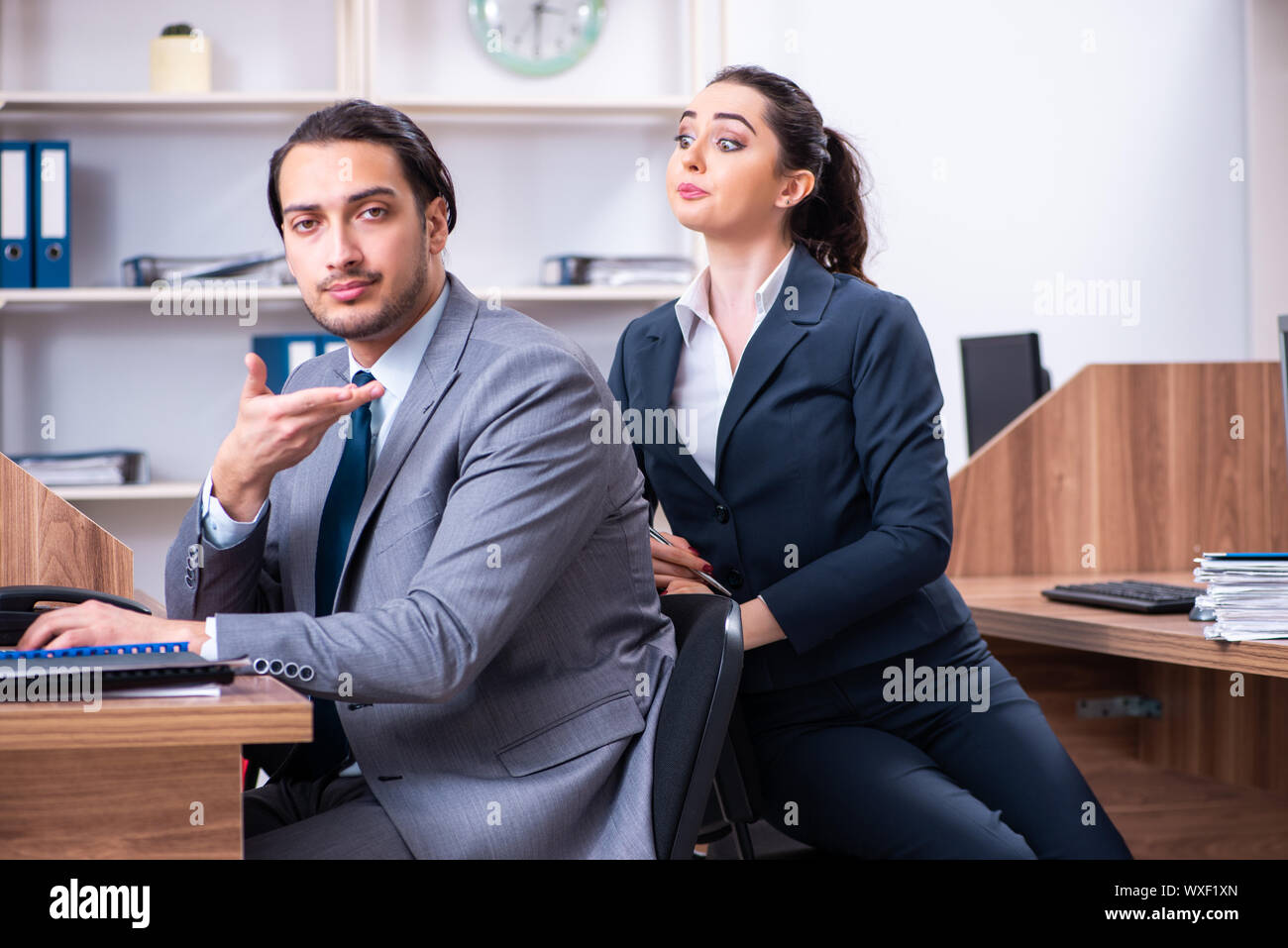 Two employees working in the office Stock Photo - Alamy