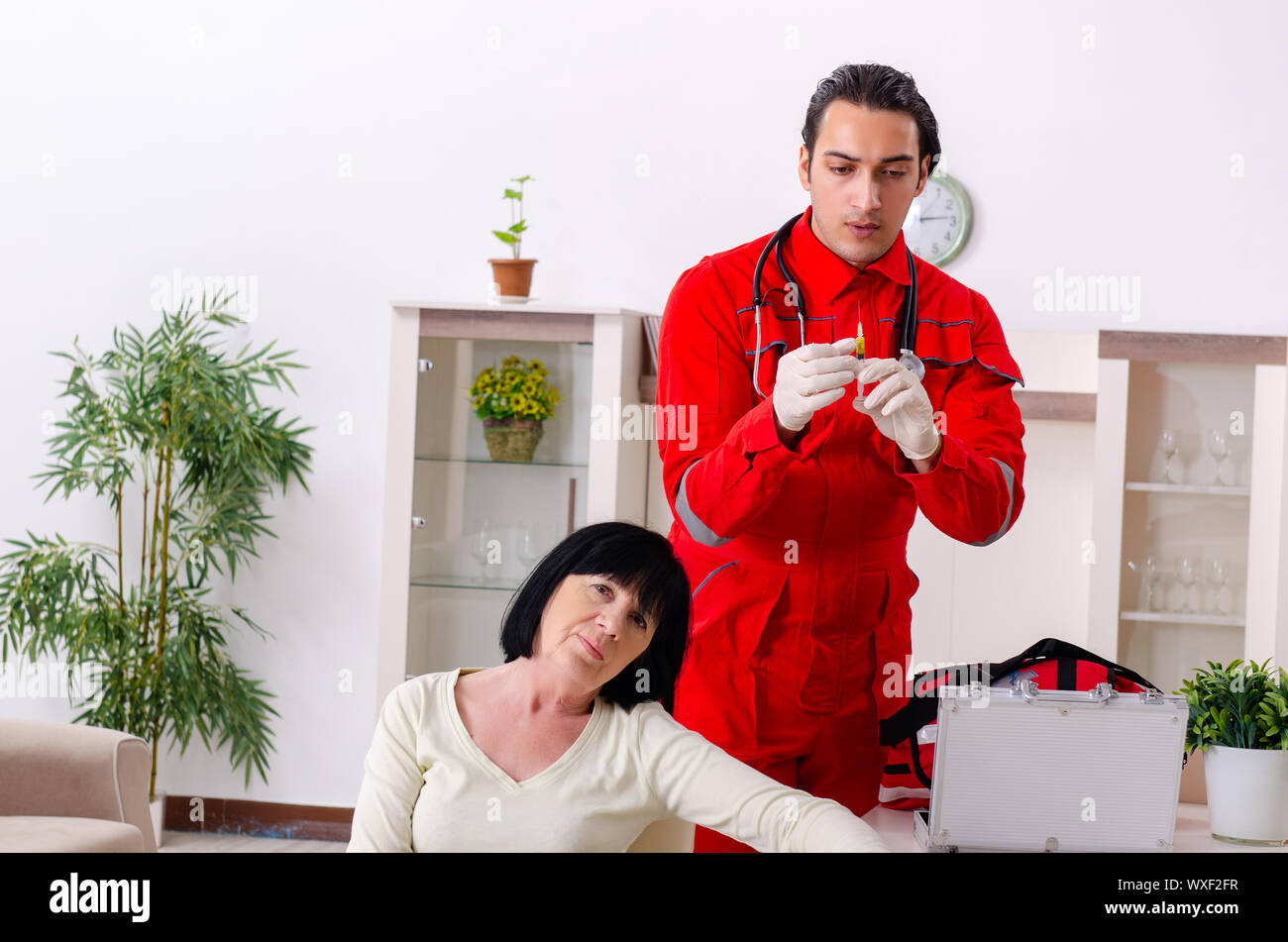 Young doctor examining senior old woman Stock Photo - Alamy