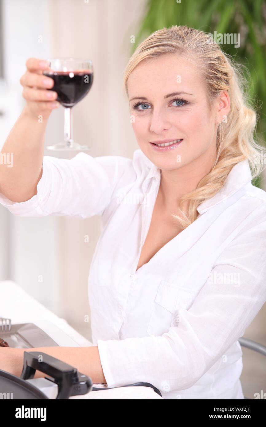 blonde woman drinking red wine Stock Photo Alamy
