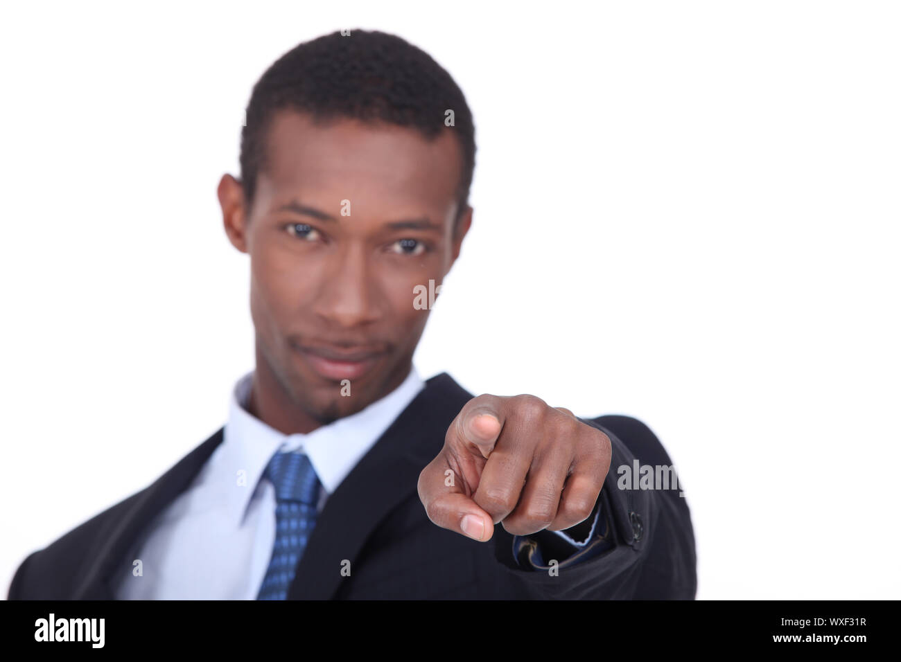 well dressed black man pointing his finger on us Stock Photo