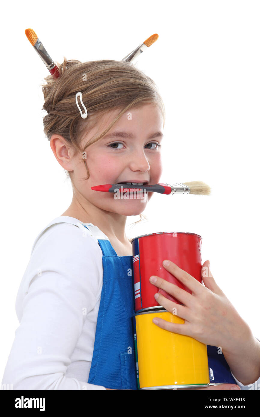 little girl in overalls painting Stock Photo Alamy
