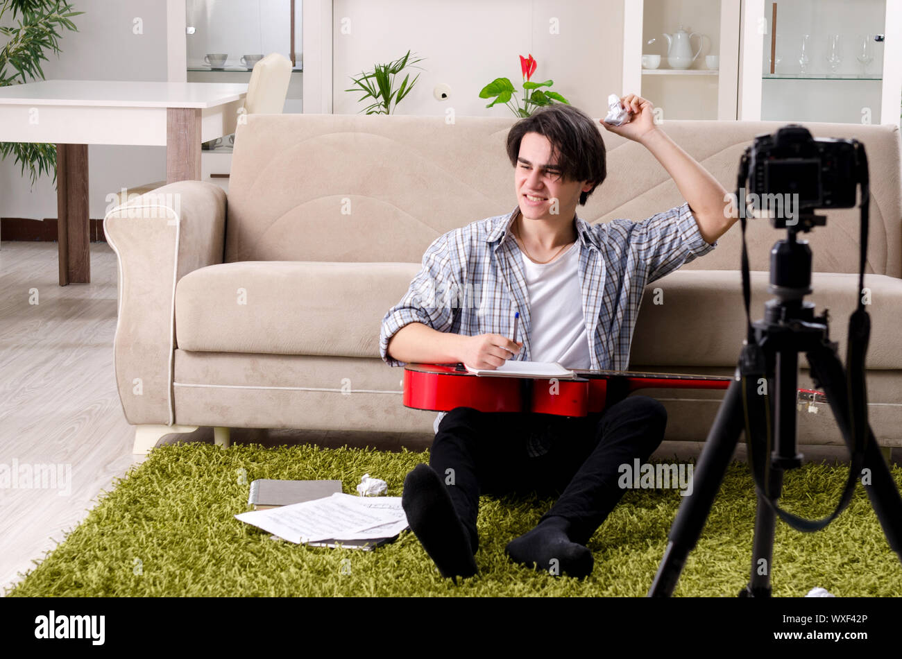 Young guitar player recording video for his blog Stock Photo