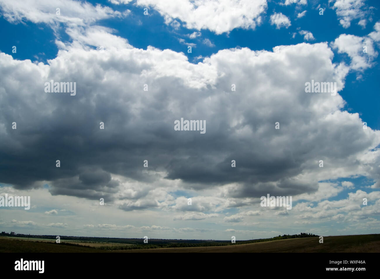 view of rural locality with low clouds in the background Stock Photo