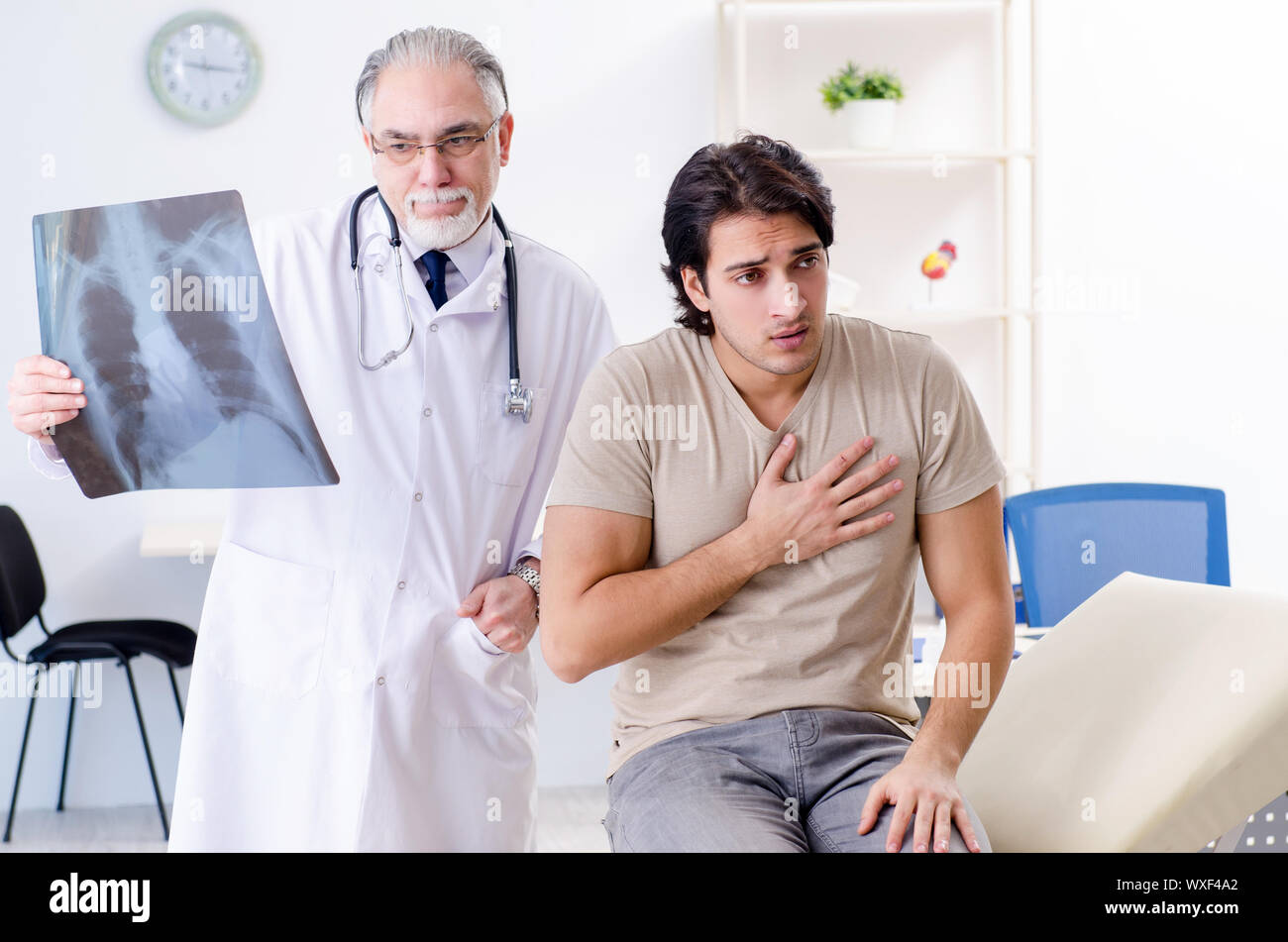 Male doctor checking lungs xray hi-res stock photography and images - Alamy
