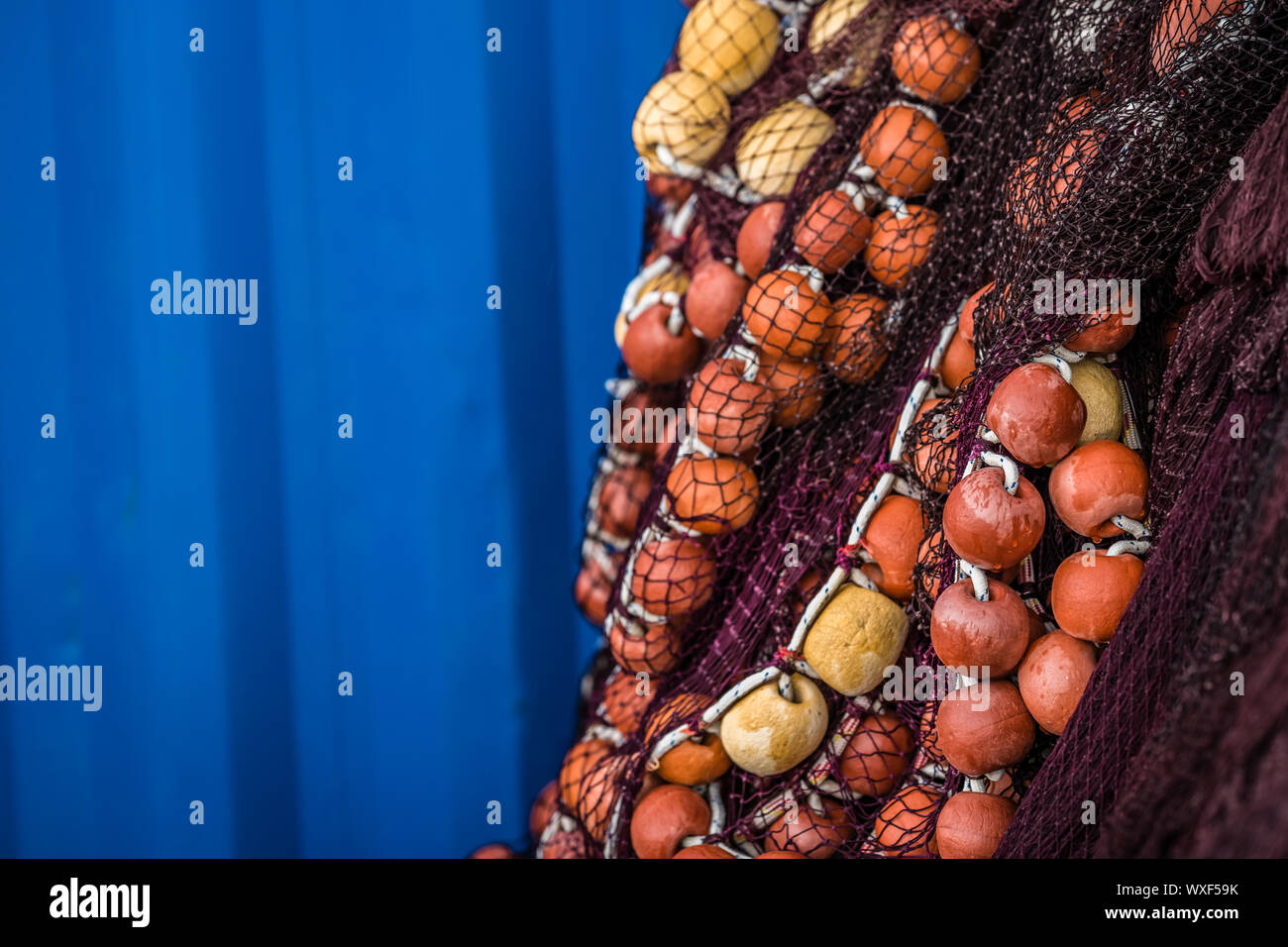 Fisherman fishing nets with blue background Stock Photo