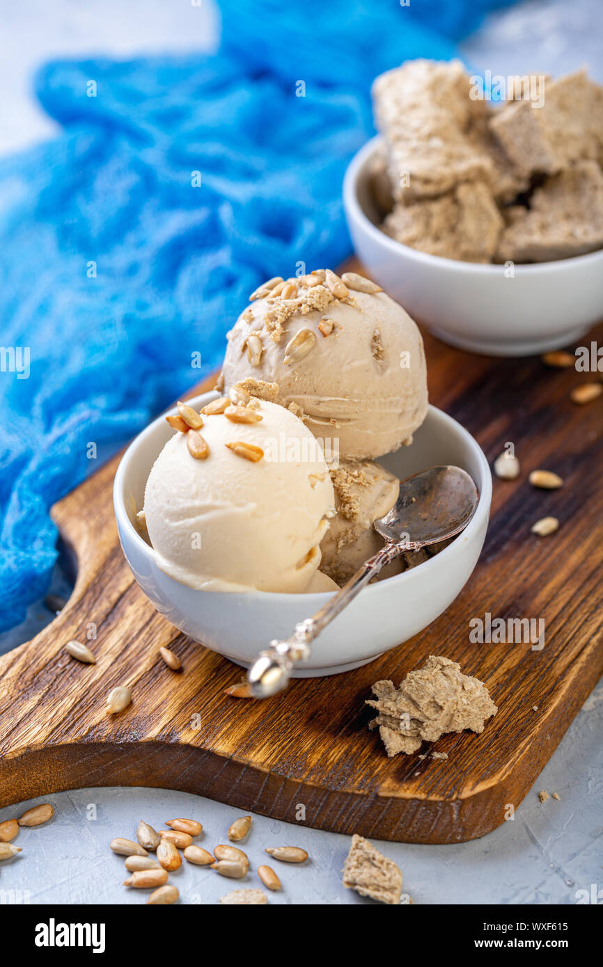 Ice cream with seeds and halva in a white bowl Stock Photo Alamy
